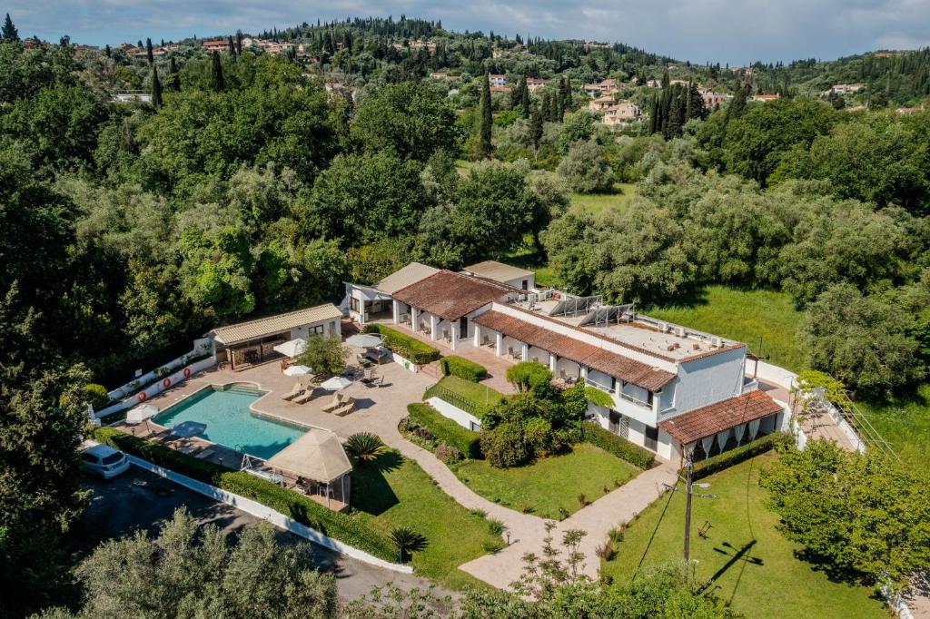 an aerial view of a house with a swimming pool at Summer Nights Resort in Ipsos