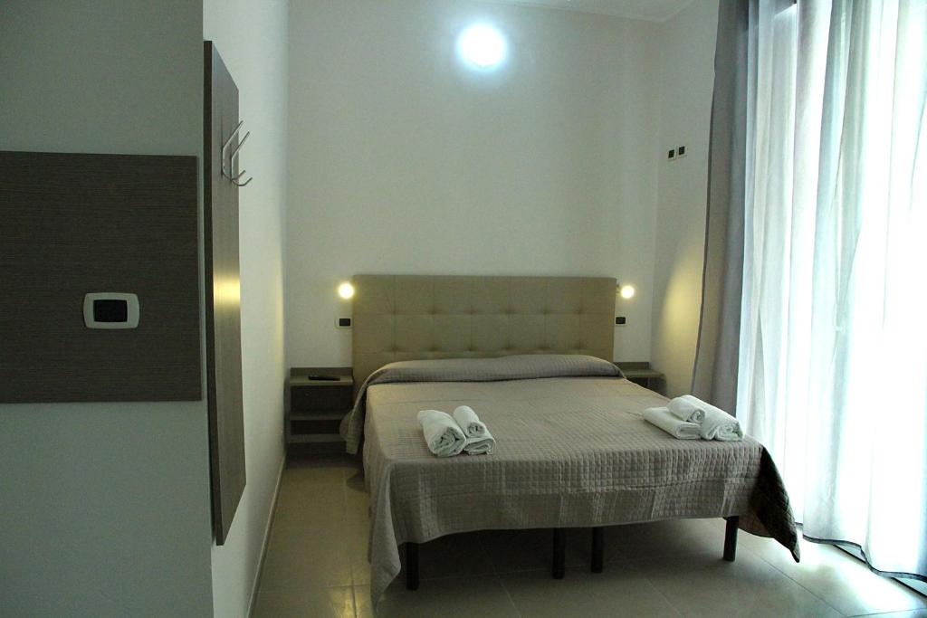 Postel nebo postele na pokoji v ubytování Hotel Sant'Elena