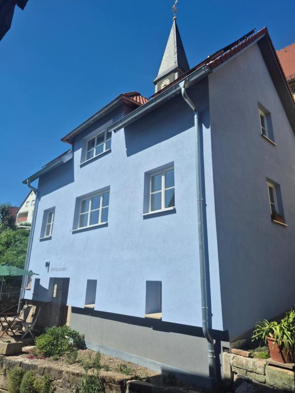 a large white building with a tower on top at Bei Jakobus in Künzelsau