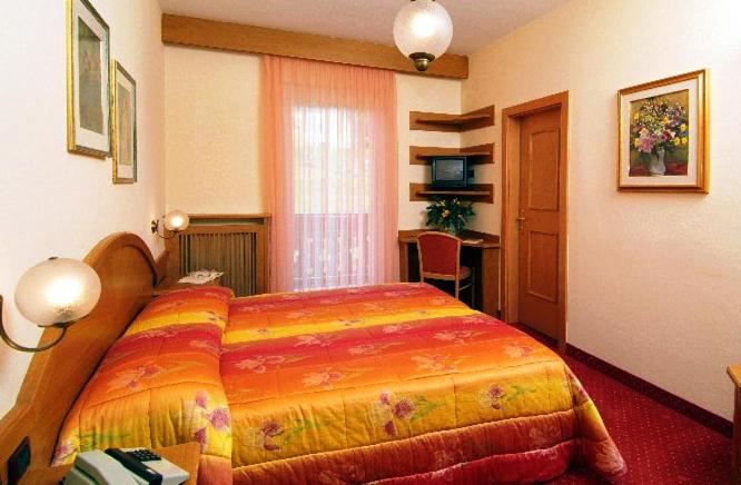 Postel nebo postele na pokoji v ubytování Hotel Europa