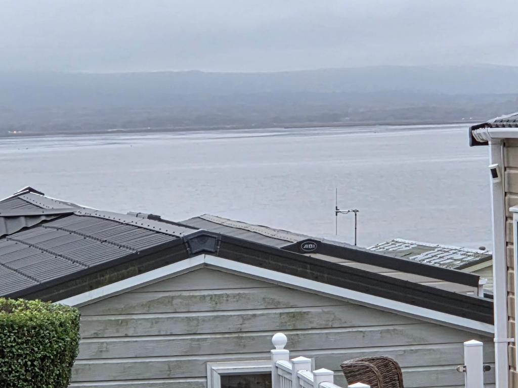 a roof of a house with a view of the water at 2 bedrooms caravan with a sea view in Poole