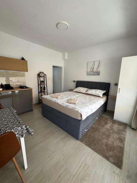 a bedroom with a large bed in a room at Studio apartman Fabi in Novigrad Istria