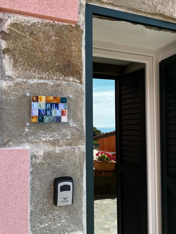 a door to a house with a mailbox next to it at La Perla Marina in Manarola