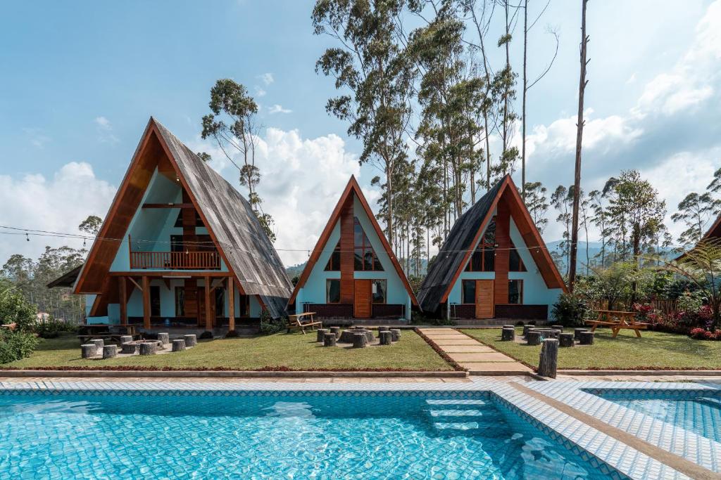 a house with a pool in front of it at The Cabin Artana By ARBA in Palayangan