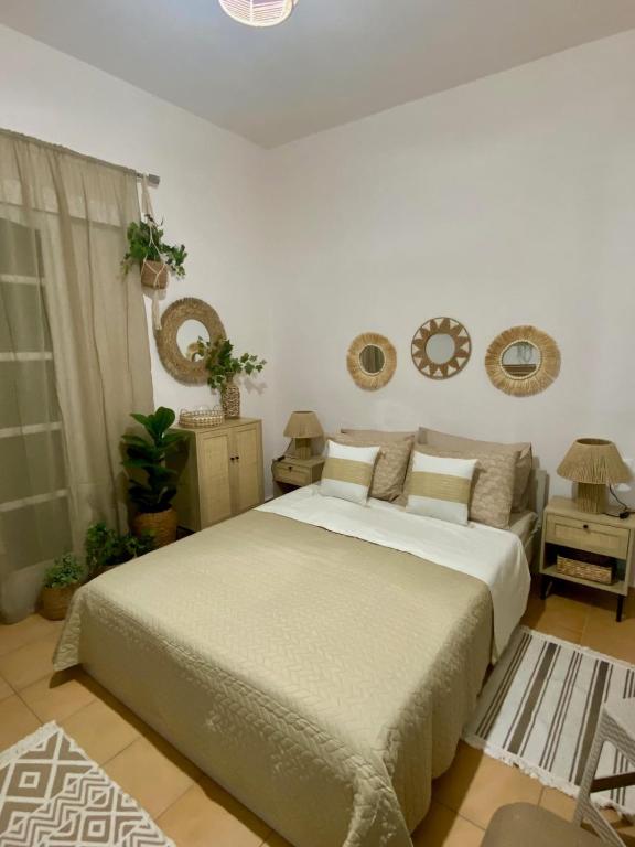 a bedroom with a large bed in a room at Studio DKMK in Malia