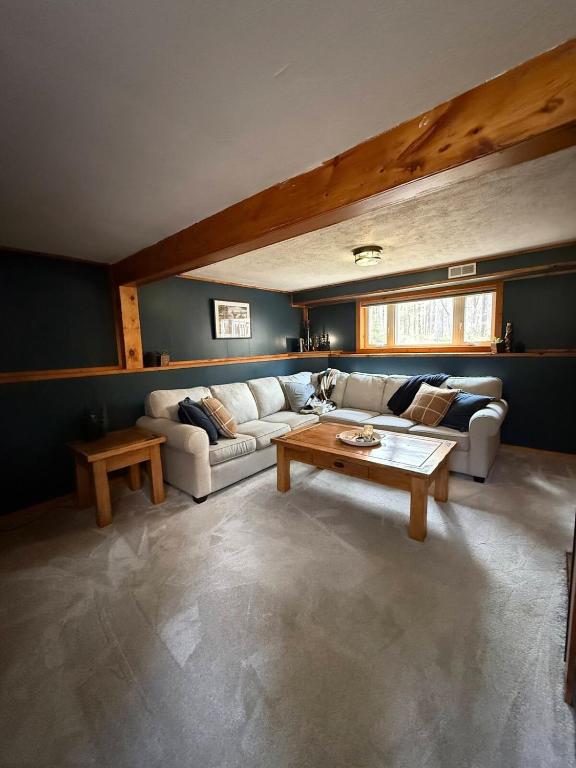 a living room with a couch and a coffee table at The Remington House in Woodruff