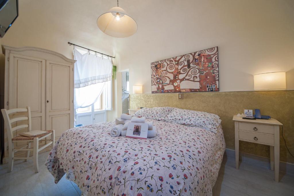 Postel nebo postele na pokoji v ubytování Albergo Etruria