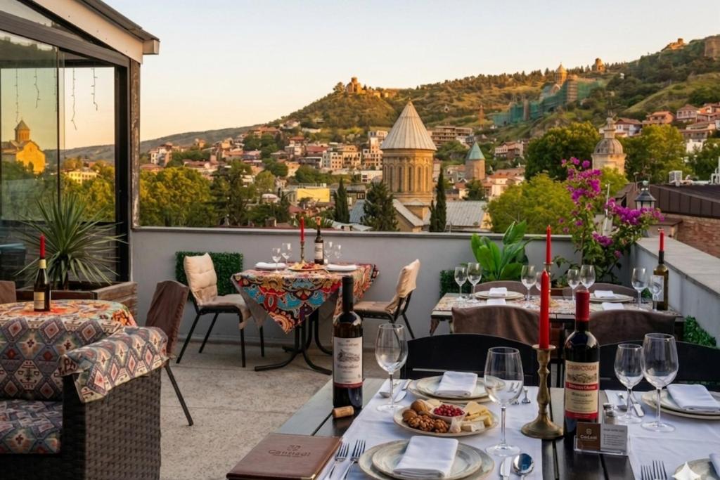 a restaurant with a view of a city at Hotel New Terrace in Tbilisi City
