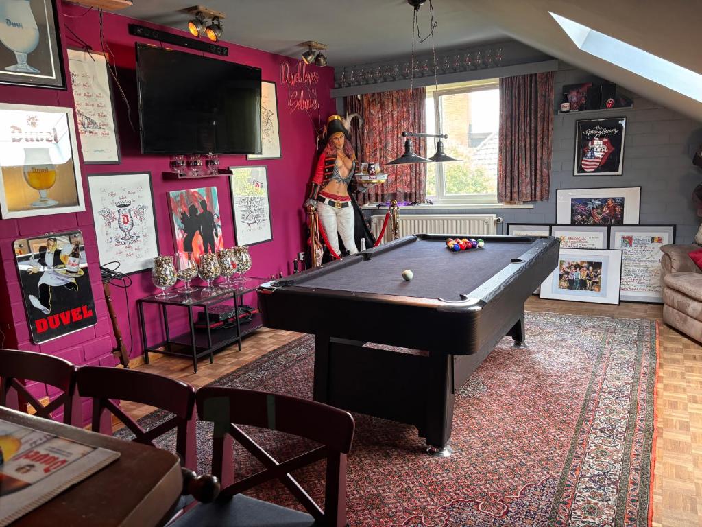 a woman standing in a room with a pool table at Selma hosts Tomorrowland 2026 in Duffel