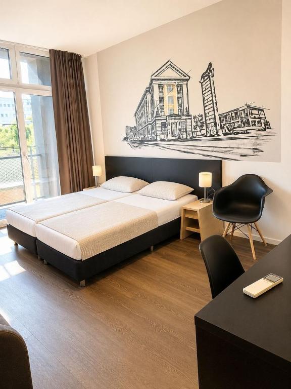 a bedroom with a bed with a drawing on the wall at Apartment Modern City in Staré Mesto
