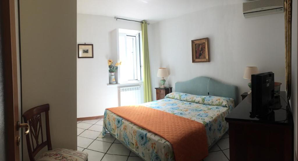 Кровать или кровати в номере Casa De Angelis