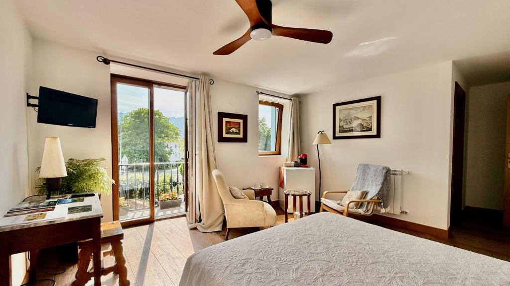 a bedroom with a bed and a ceiling fan at Matxiku Aurre in Berástegui