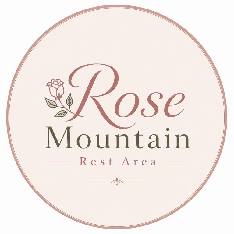 a logo for a rose mountain rest area at Rosa mountain reast in Al ‘Aqar