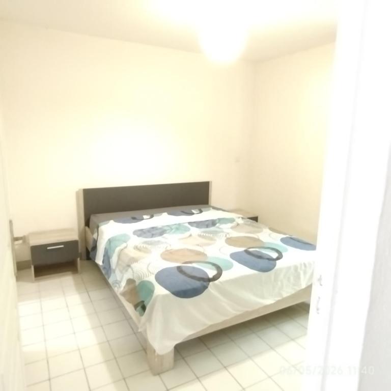 a bedroom with a large bed in a room at Tikanel in Schœlcher