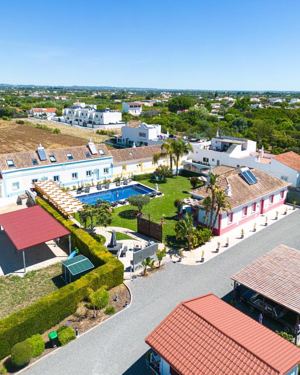 an aerial view of a house with a pool at Maria's Village in Tavira