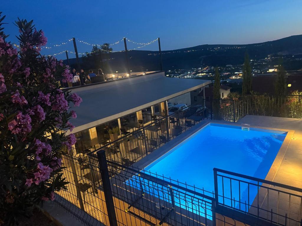 a swimming pool with a view of the golden gate bridge at Residence Spa Apartments DUB in Kotor