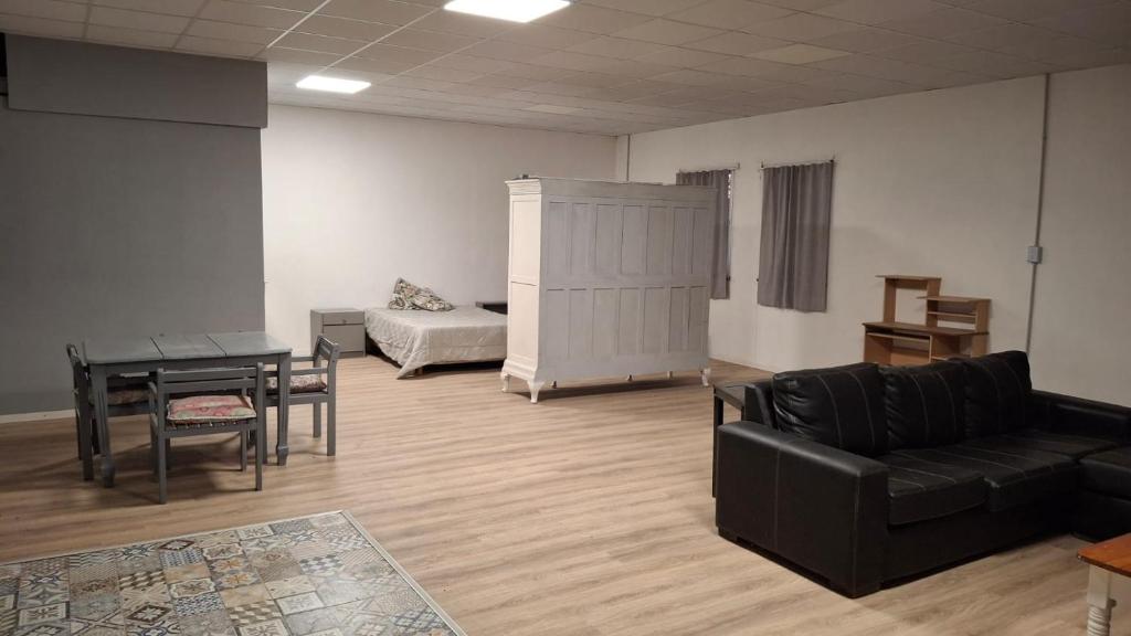 a living room with a couch and a table at Loft in Funes