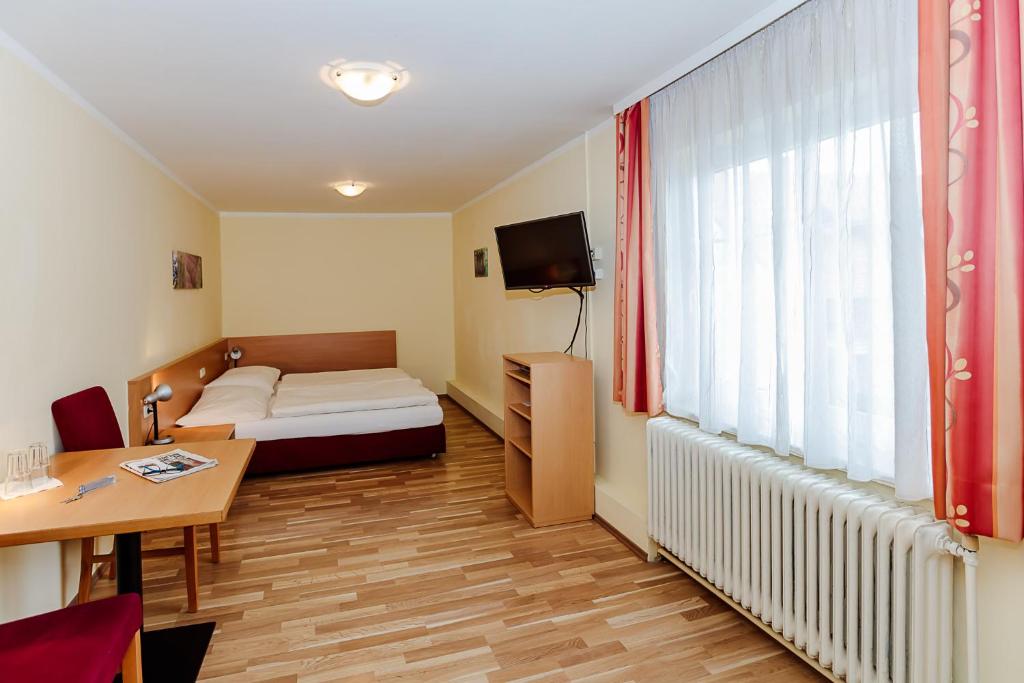 Postel nebo postele na pokoji v ubytování Hotel Denk Bed & Breakfast