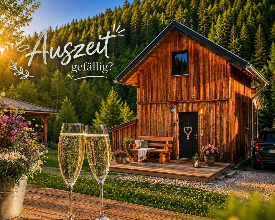 two glasses of champagne in front of a cabin at Chalet SCHNEEHASE 10min - Kreischberg in Stadl an der Mur