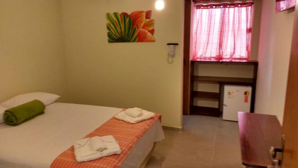 Postel nebo postele na pokoji v ubytování Hotel Pousada Rio Mar