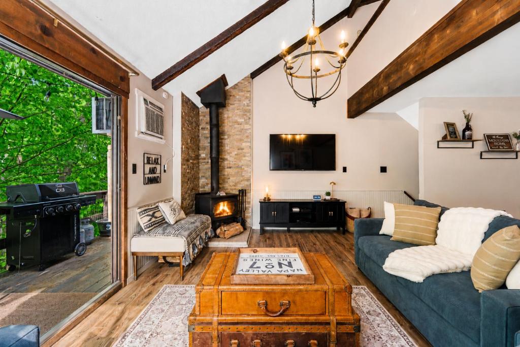 a living room with a couch and a fireplace at Ski-OnSki-Off Camelback Arcade Pool in Tannersville
