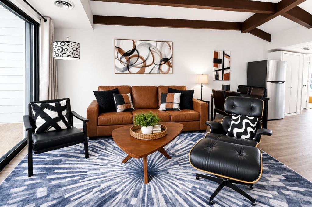 a living room with a couch and two chairs at Happy Harbor at Kimberling Crossing in Kimberling City