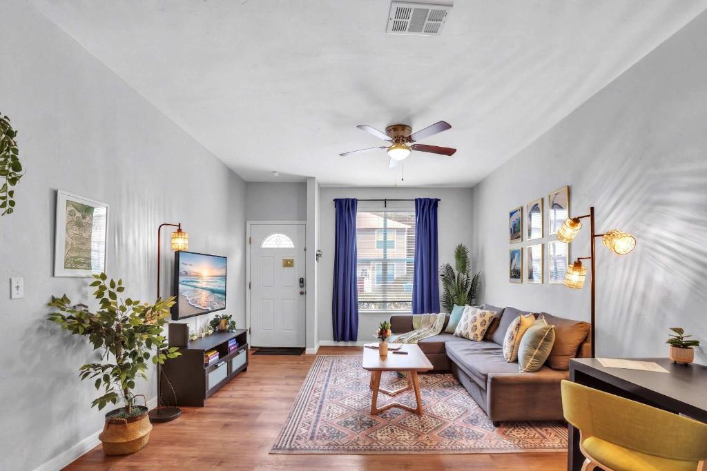 a living room with a couch and a ceiling fan at The Prairie at Brighton - UF , Pool , Workspace in Gainesville