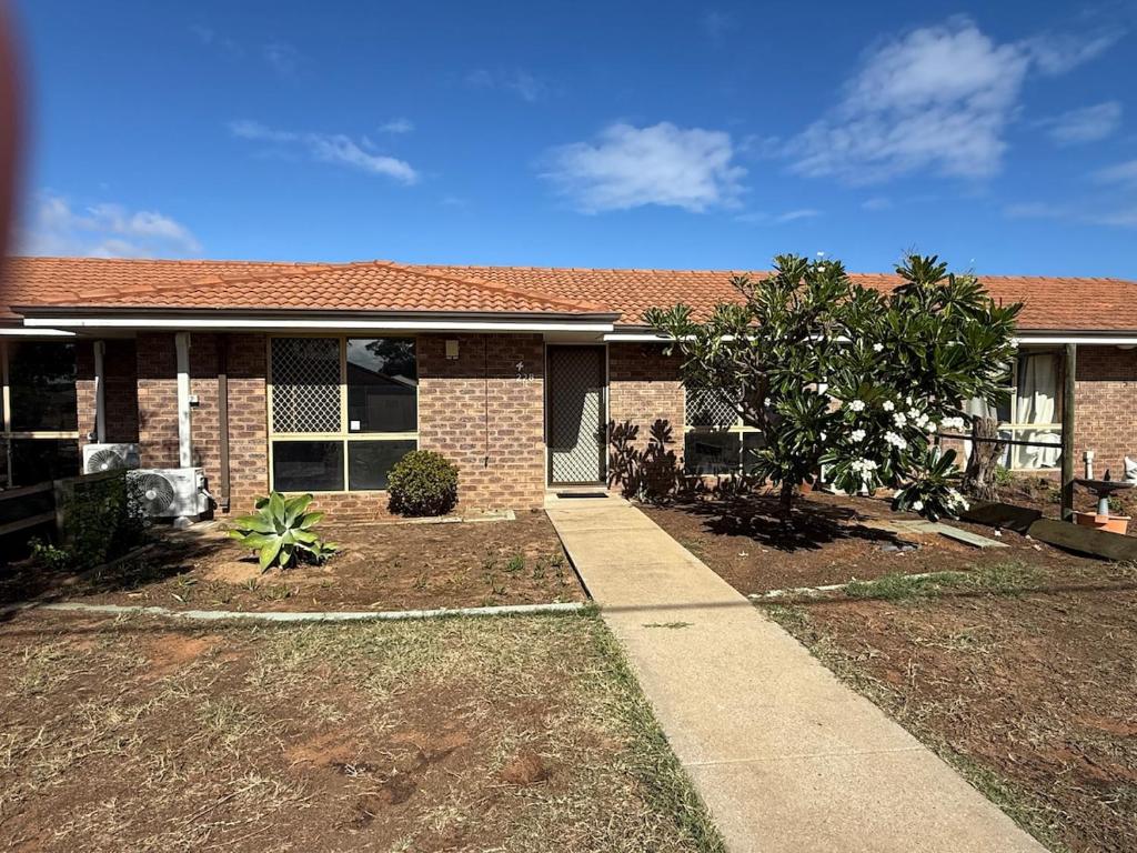 a brick house with a sidewalk in front of it at Entire 2 bedrooms unit in Geraldton