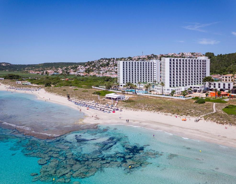 an aerial view of a beach with hotels and the ocean at SOL by Meliá Milanos Pingüinos in Son Bou