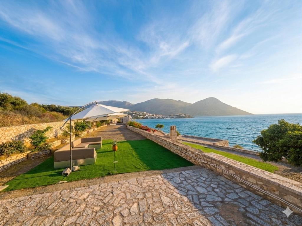 a house with a view of the water at Ticallisti Rooms by Villa Lagkadaki in Agriliá