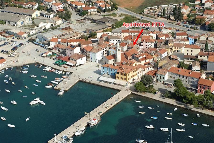 an aerial view of a harbor with boats in the water at Apartment Etta in Fažana