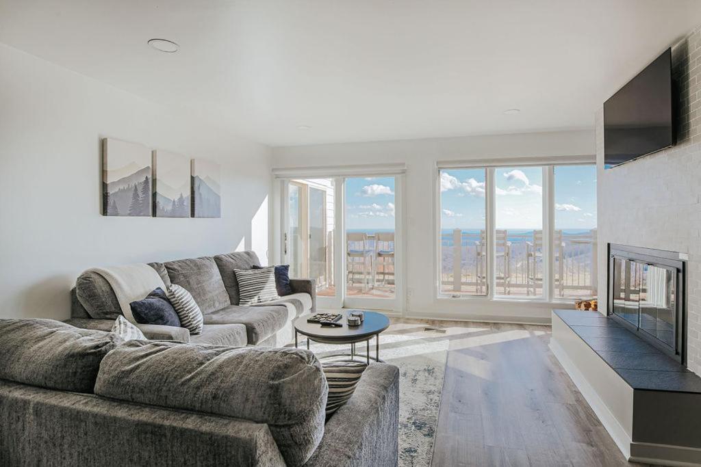 a living room with a couch and a fireplace at Mountain View Vista in Mount Torry Furnace