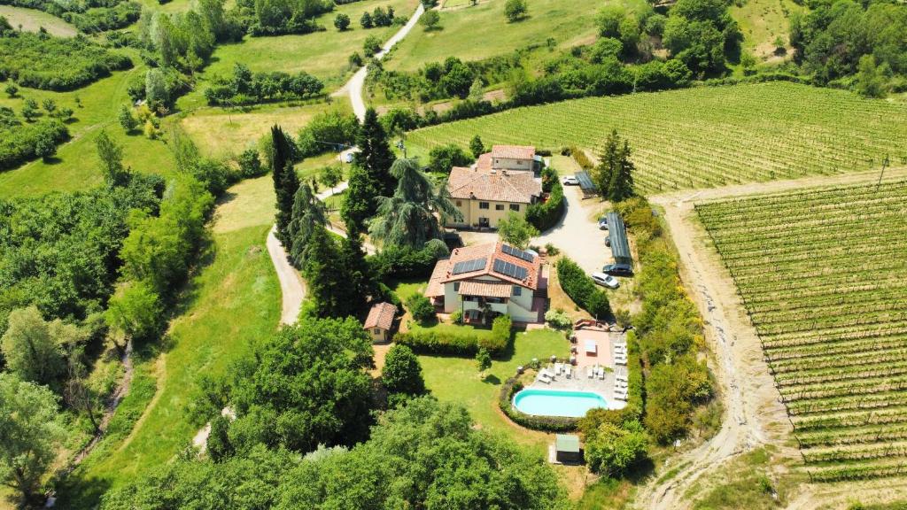 an aerial view of a house in a vineyard at Villa Buonasera Agriturismo in Greve in Chianti