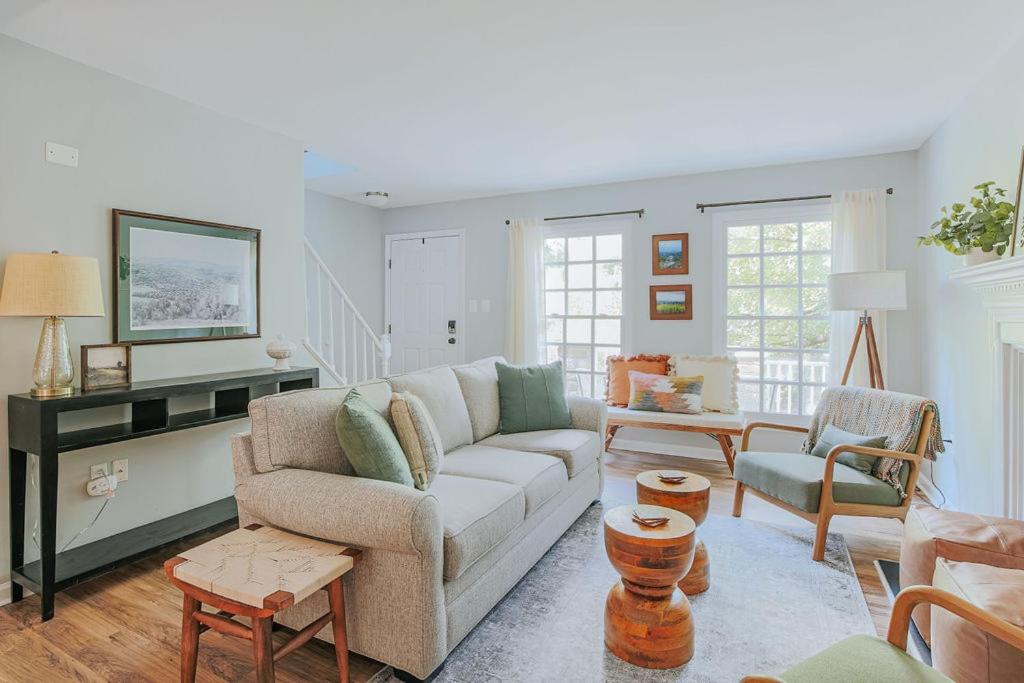 a living room with a couch and a table at Stuart Cottage in Staunton