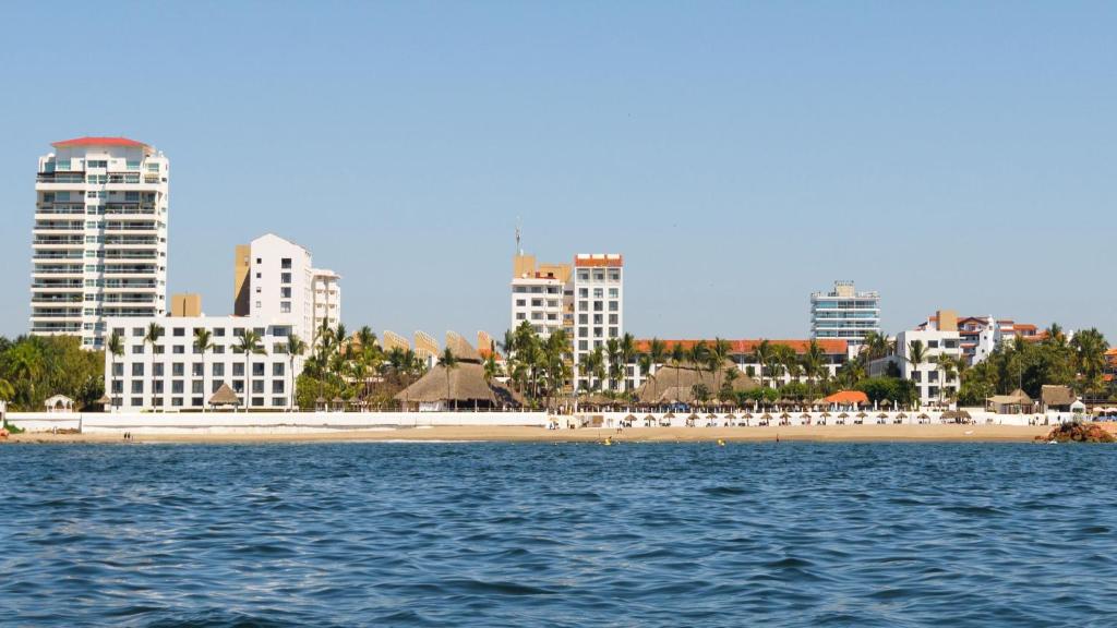 a view of a beach and a city from the water at Meliá Puerto Vallarta in Puerto Vallarta