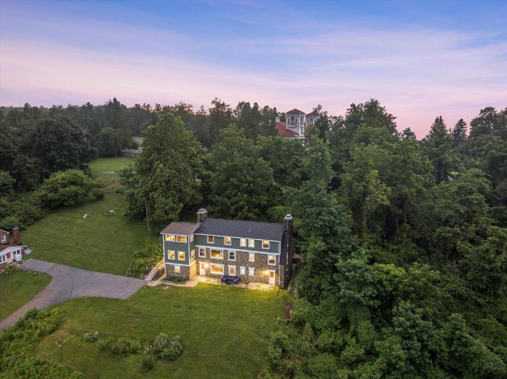 an aerial view of a large house in the woods at Swannanoa Guest House in Afton