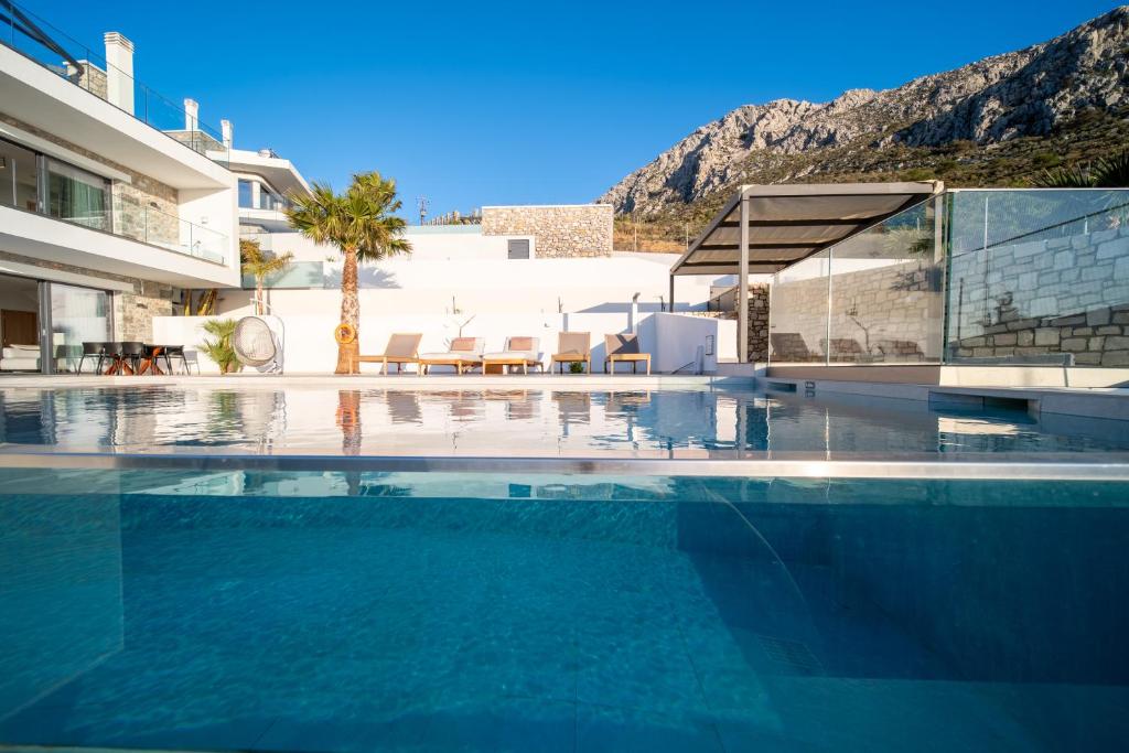 a swimming pool in a villa with a view at Secret Oasis in Lefkogeia