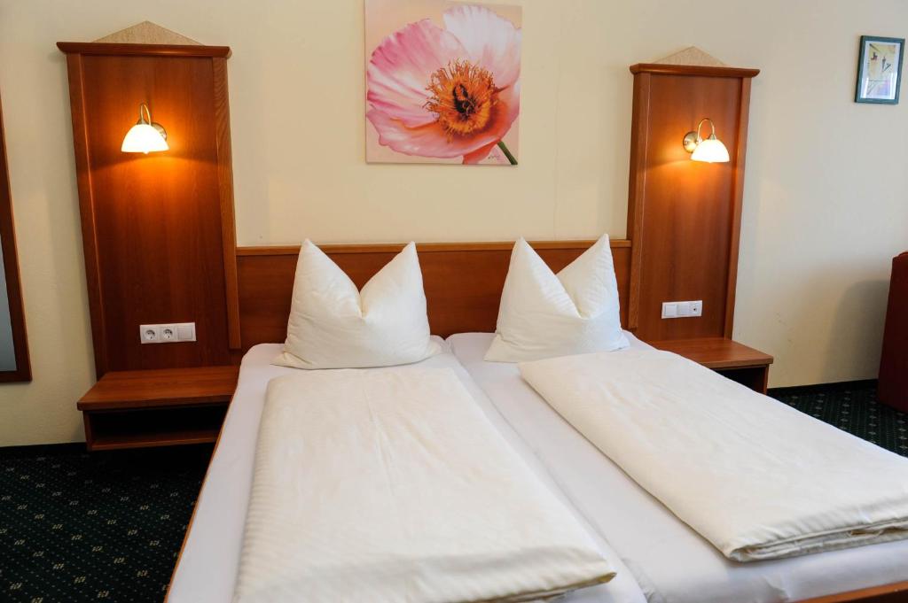 Postel nebo postele na pokoji v ubytování Hotel Posauner