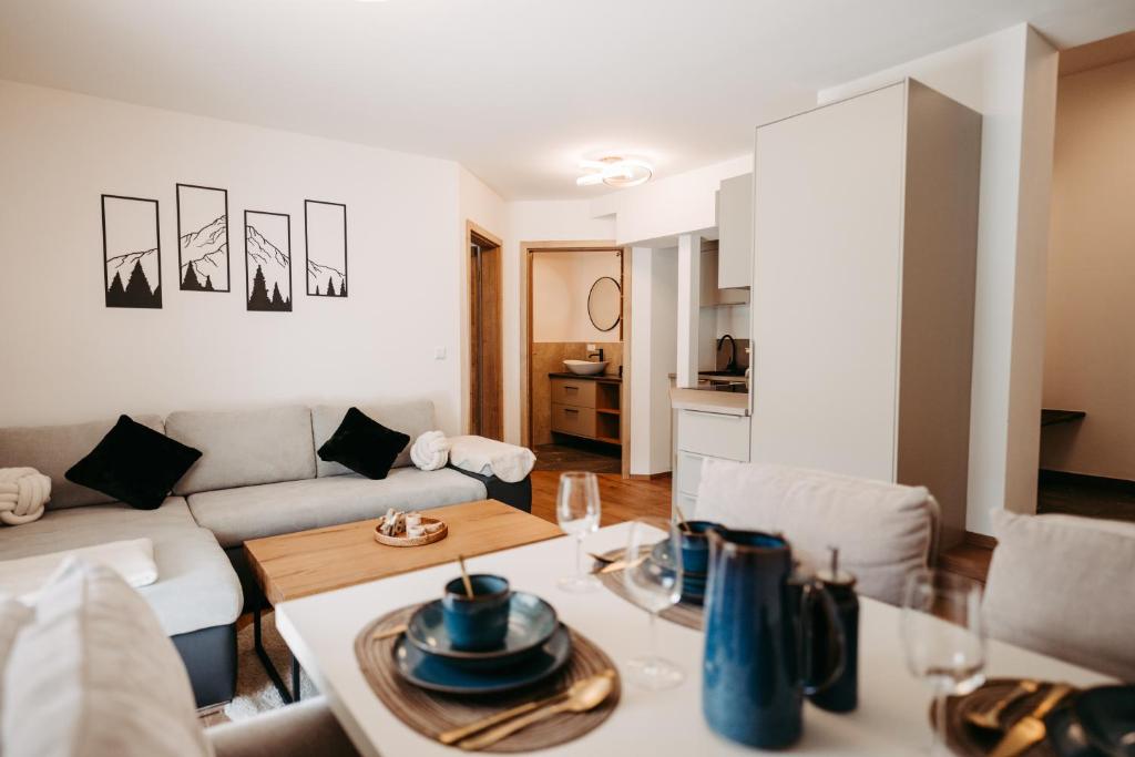 a living room with a couch and a table at Longaview in Weisspriach