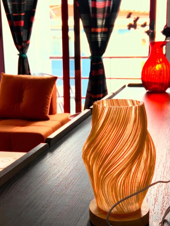 two vases sitting on a table in a living room at City Centre Rooms 4R in Shkodër