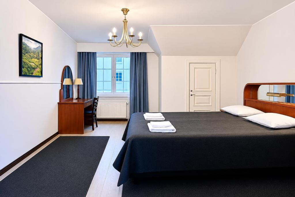Vuode tai vuoteita majoituspaikassa Senate Hotel