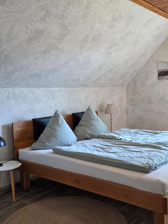 a large bed in a room with at Fuchs & Hase in Uplengen