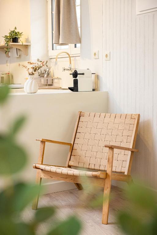 a wooden bench in a kitchen with a sink at Aesop Homes in Pythagoreio
