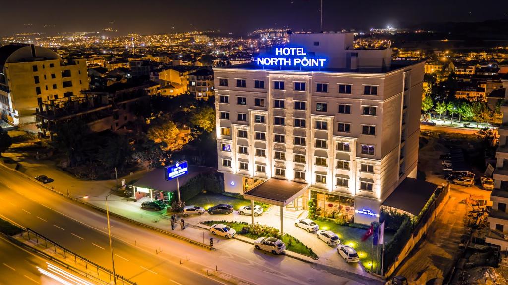 a view of a hotel north point at night at North Point Hotel in Denizli