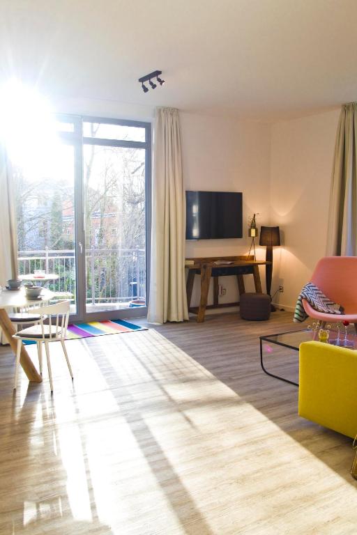 TV a/nebo společenská místnost v ubytování Appartements Villa Schwanenteich