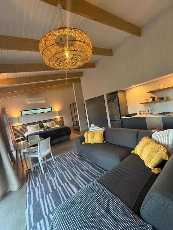 a living room with a couch and a table at The Sleep Studio in Kampersrus AH