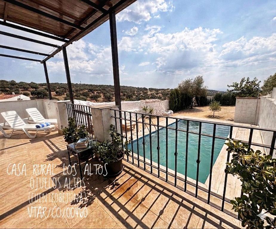 a balcony of a house with a swimming pool at CASA RURAL LOS ALTOS in Ojuelos Altos