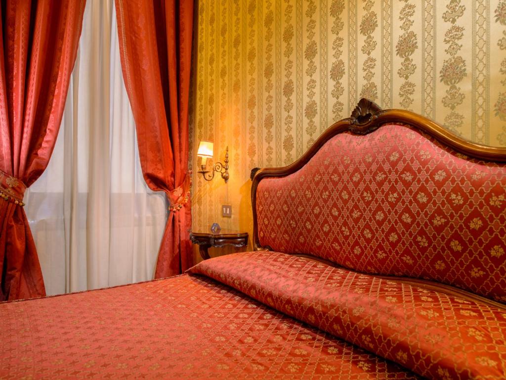 Postel nebo postele na pokoji v ubytování Centauro Hotel