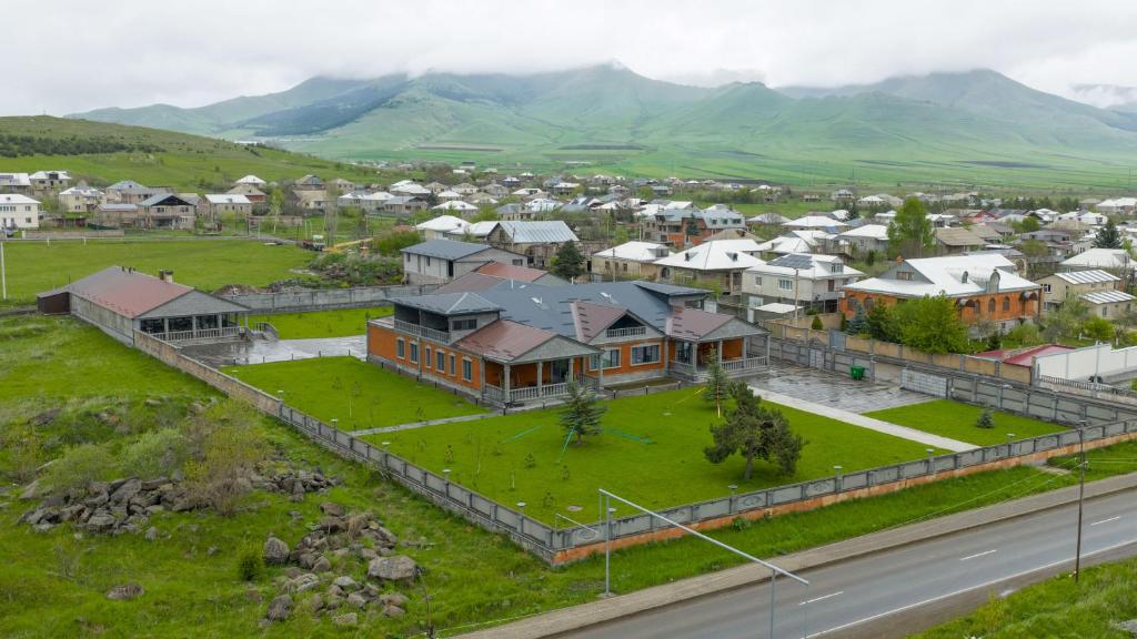 an aerial view of a city with houses and a road at GRIG Villa & Hotel in Stepʼanavan