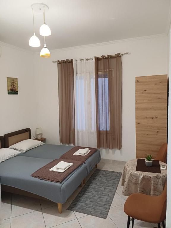 a bedroom with a bed and a table in it at Studio Rada in Ulcinj